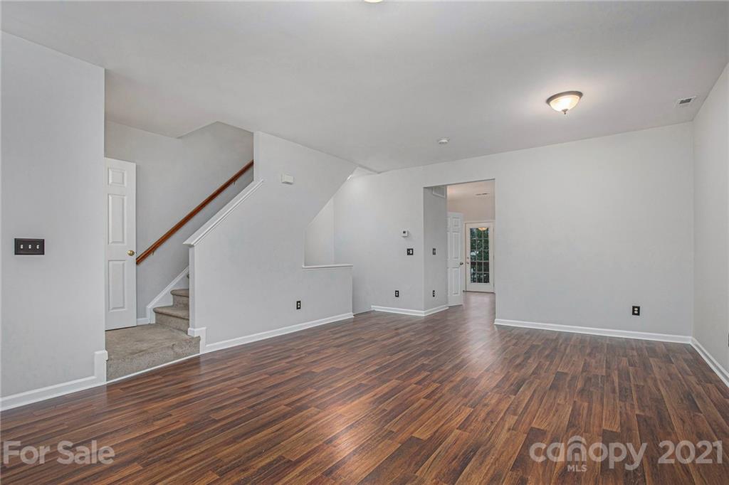 9230 Washam Potts Road Cornelius, NC 28031 - Photo 11 of 31 a view of empty room with wooden floor