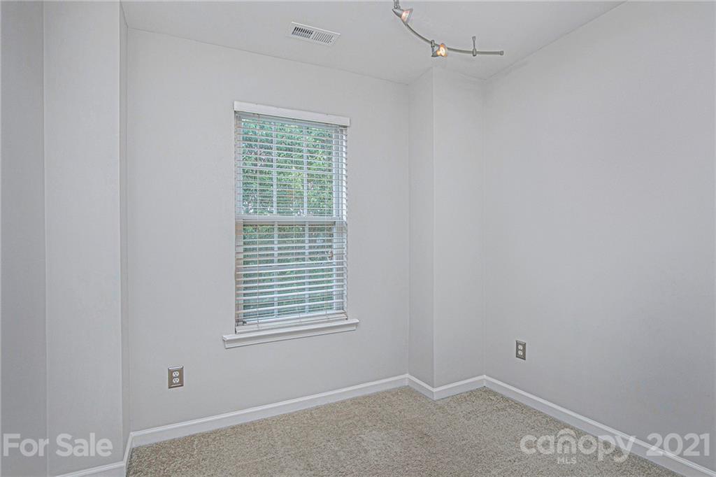 9230 Washam Potts Road Cornelius, NC 28031 - Photo 20 of 31 a room that has a window in it