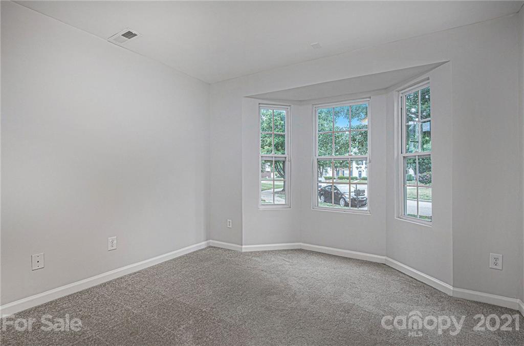 9230 Washam Potts Road Cornelius, NC 28031 - Photo 7 of 31 an empty room with a window