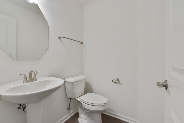 1627 Sager Way Batavia, IL 60510 - Photo 14 of 25 a bathroom with a sink toilet and a mirror