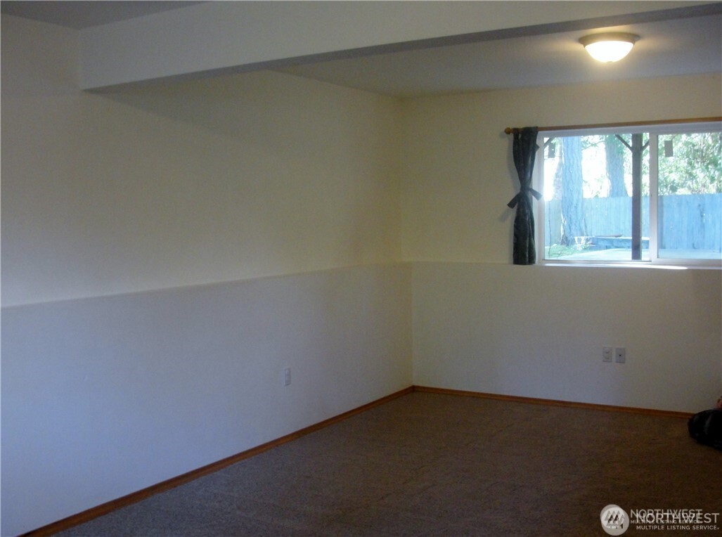 1664 Spruce Ridge Drive Camano Island, WA 98282 - Photo 14 of 24 an empty room with a window
