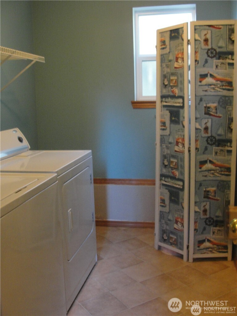 1664 Spruce Ridge Drive Camano Island, WA 98282 - Photo 15 of 24 a view of storage and utility room with washer and dryer