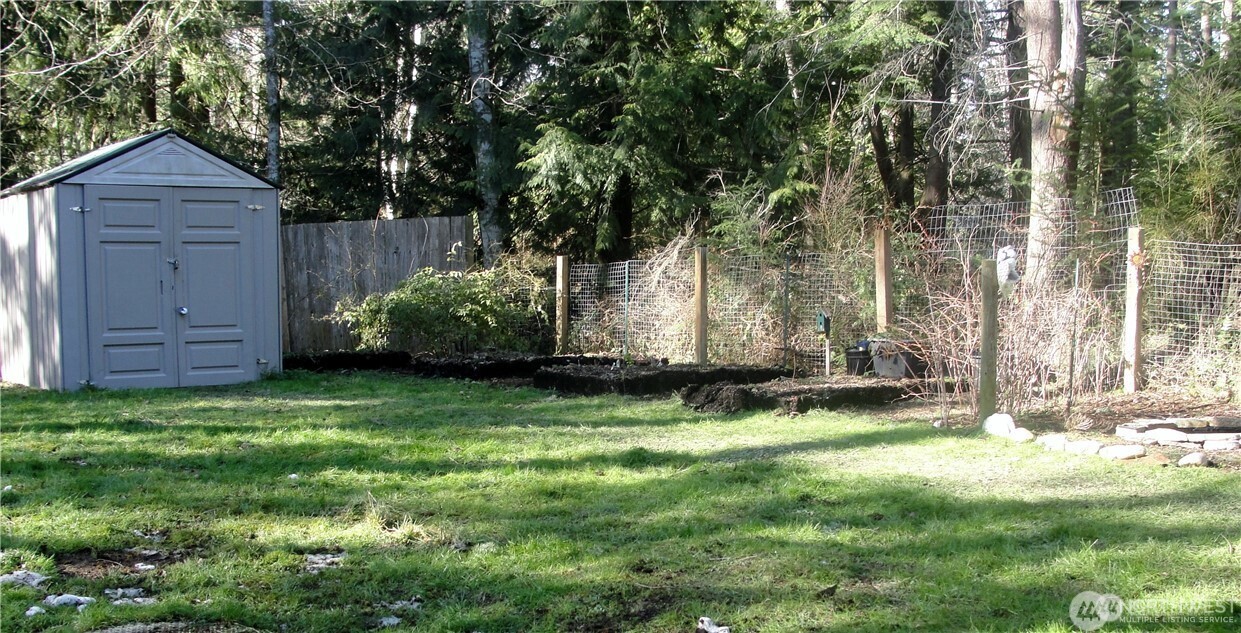 1664 Spruce Ridge Drive Camano Island, WA 98282 - Photo 18 of 24 a backyard of a house