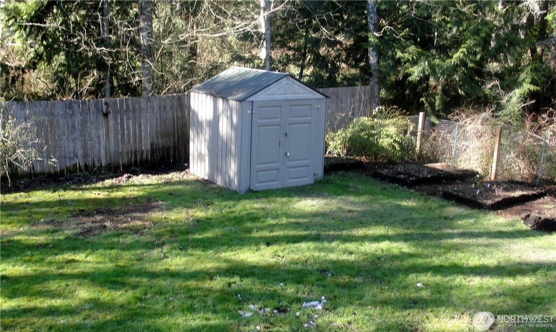 1664 Spruce Ridge Drive Camano Island, WA 98282 - Photo 19 of 24 a backyard of a house