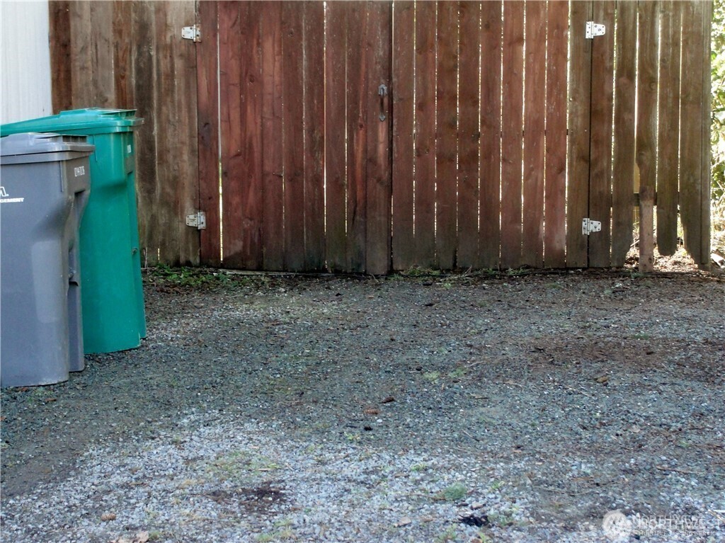 1664 Spruce Ridge Drive Camano Island, WA 98282 - Photo 23 of 24 a view of a backyard with wooden fence