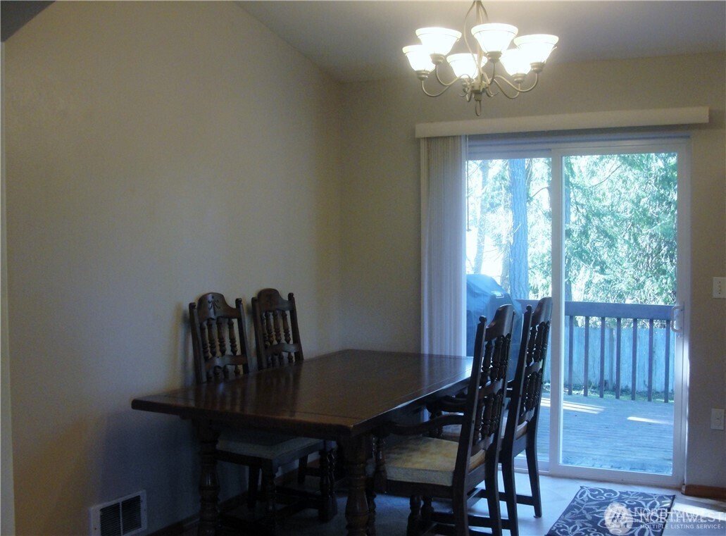 1664 Spruce Ridge Drive Camano Island, WA 98282 - Photo 7 of 24 a view of a dining room with furniture window and outside view
