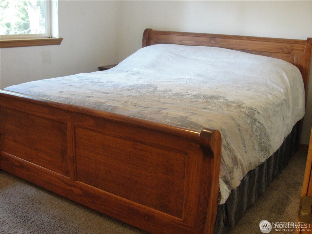 1664 Spruce Ridge Drive Camano Island, WA 98282 - Photo 8 of 24 a bedroom with a bed