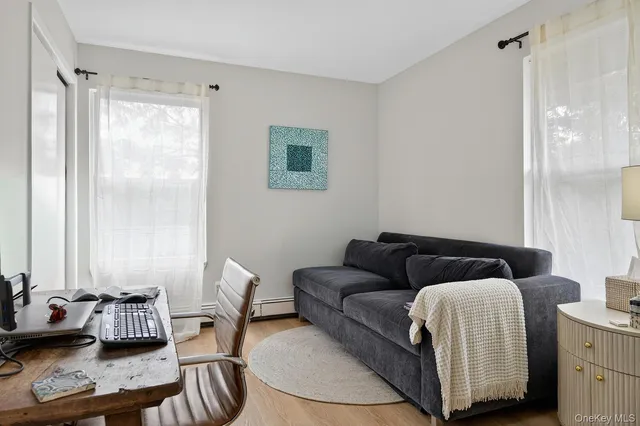 a living room with furniture and a window