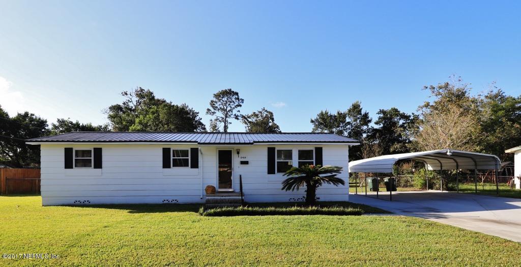 10414 Stone Road Jacksonville, FL 32246 - Photo 1 of 23 a front view of a house with a yard
