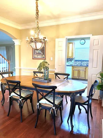 a dining room with furniture and window