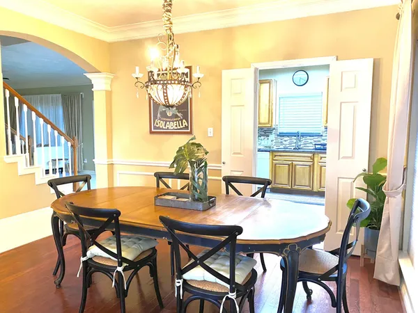 a dining room view with a table and chairs