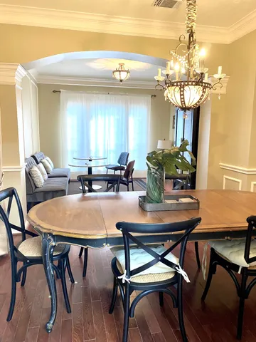 a dining room view with a table and chairs