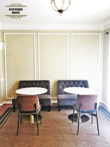 a view of a workspace with furniture