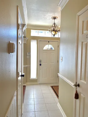 a spacious bathroom with a sink and a mirror