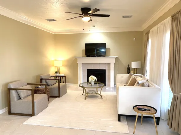 a living room with furniture and a fireplace