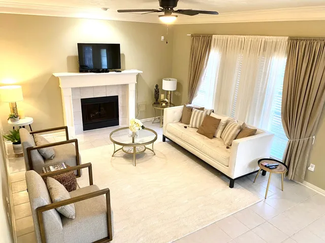 a living room with furniture and a fireplace