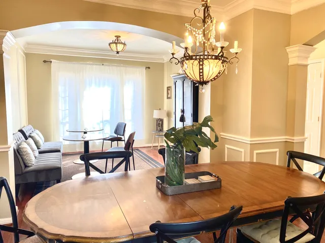 a view of a dining room with furniture and window