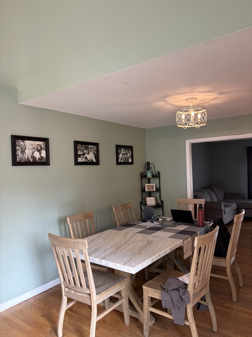 609 West Gartner Road Naperville, IL 60540 - Photo 6 of 23 a view of a dining room with furniture