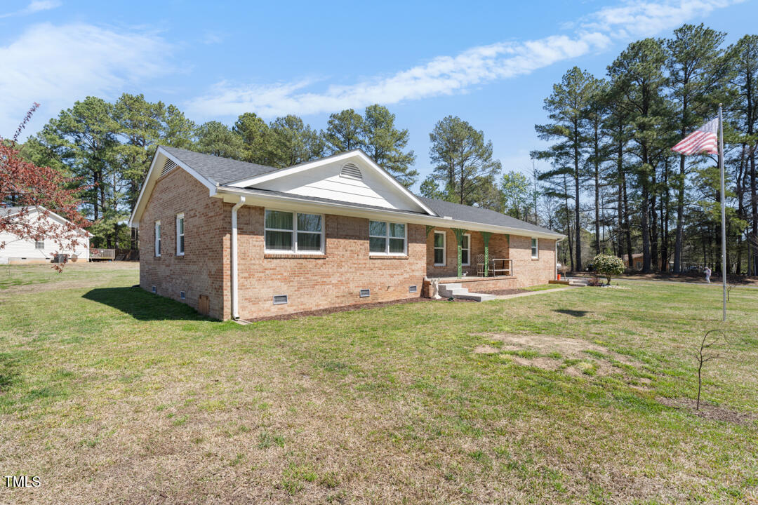 916 Clayton Road Durham, NC 27703 - Photo 20 of 32 a view of a house with a backyard