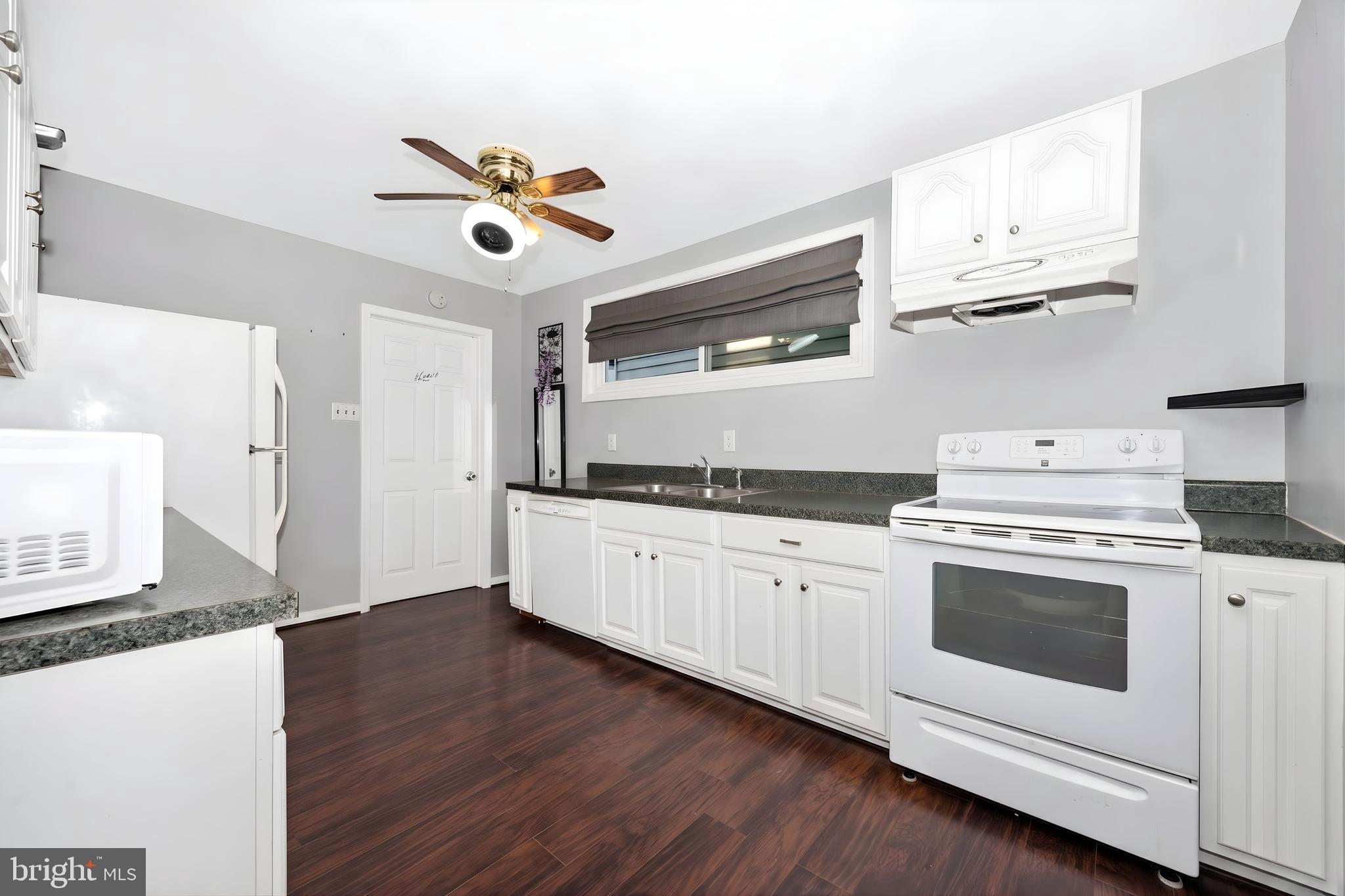 808 Knoxville Road Knoxville, MD 21758 - Photo 2 of 14 a kitchen with stainless steel appliances granite countertop a stove and a sink