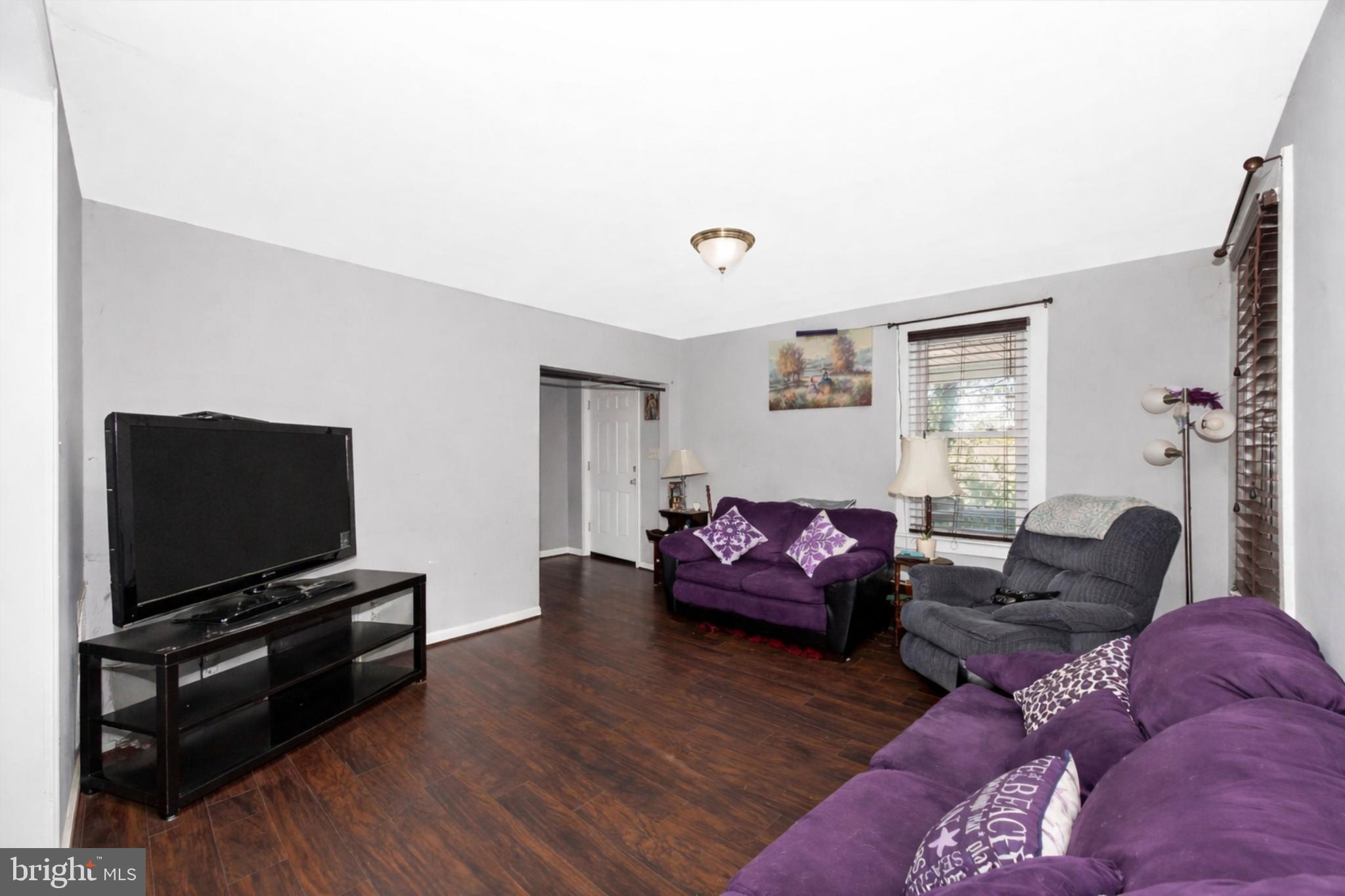 808 Knoxville Road Knoxville, MD 21758 - Photo 5 of 14 a living room with furniture and a flat screen tv