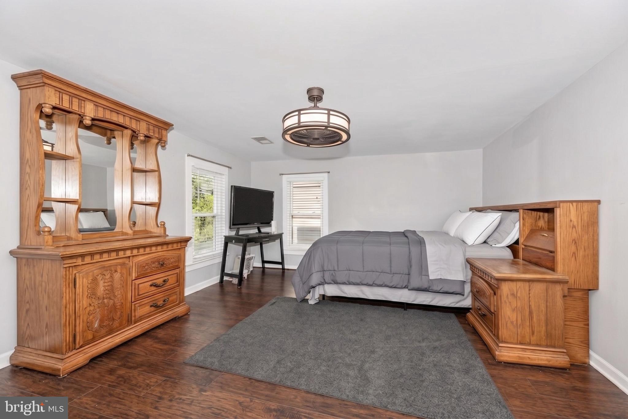 808 Knoxville Road Knoxville, MD 21758 - Photo 6 of 14 a living room with furniture and a flat screen tv