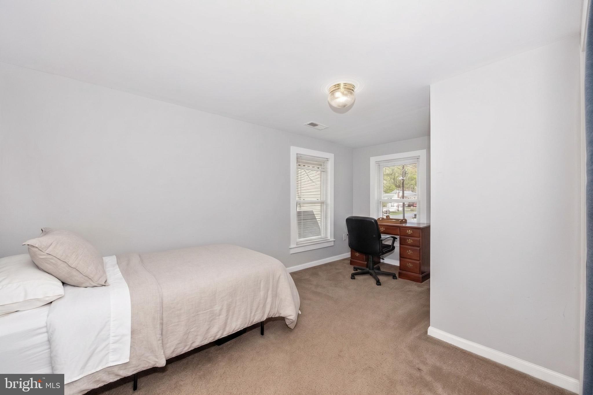 808 Knoxville Road Knoxville, MD 21758 - Photo 7 of 14 a bedroom with a bed and furniture