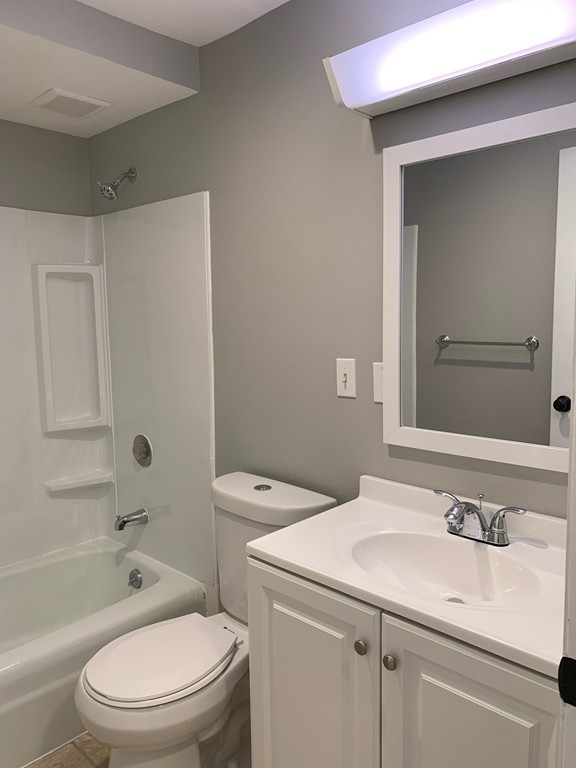 96 Main Street, Unit C4 Foxboro, MA 02035 - Photo 11 of 14 a bathroom with a sink a toilet and shower