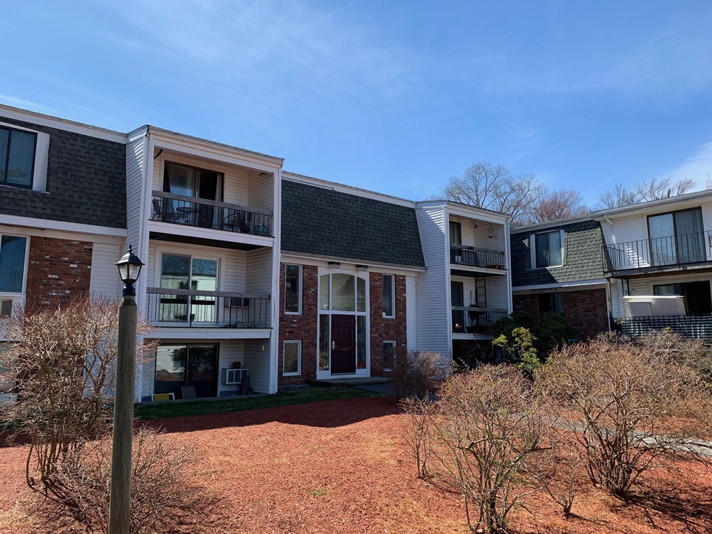 96 Main Street, Unit C4 Foxboro, MA 02035 - Photo 2 of 14 a front view of a house with a yard