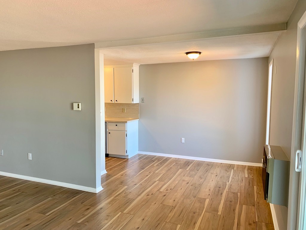 96 Main Street, Unit C4 Foxboro, MA 02035 - Photo 5 of 14 a view of empty room with wooden floor and entryway