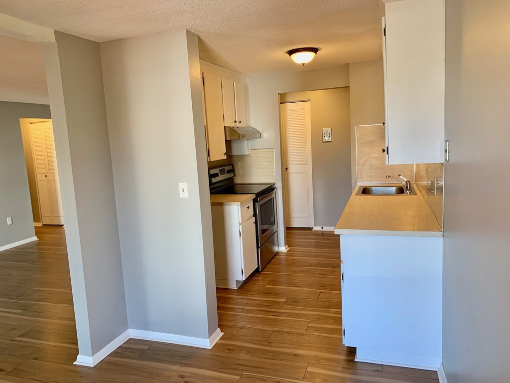 96 Main Street, Unit C4 Foxboro, MA 02035 - Photo 6 of 14 a kitchen with sink and refrigerator