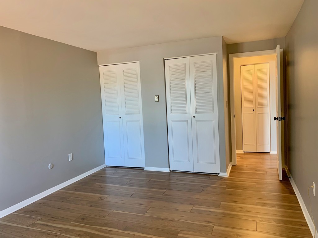 96 Main Street, Unit C4 Foxboro, MA 02035 - Photo 10 of 14 a view of an empty room with wooden floor