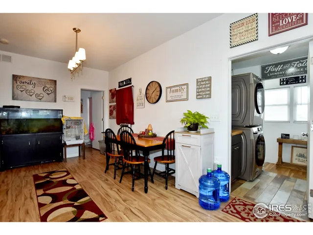 a living room with furniture a rug and a fireplace