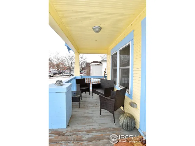 a living room with a couch and chairs