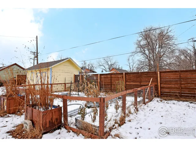 a view of house with wooden fence