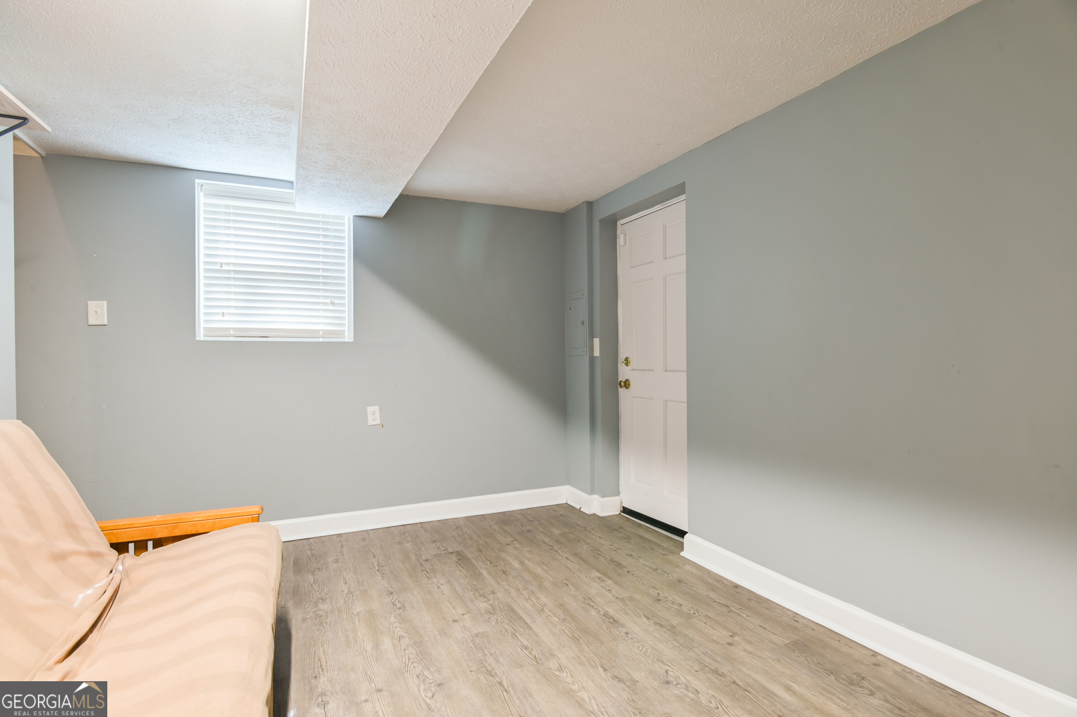 545 Forest Hill Road Macon, GA 31210 - Photo 59 of 63 an empty room with wooden floor and windows