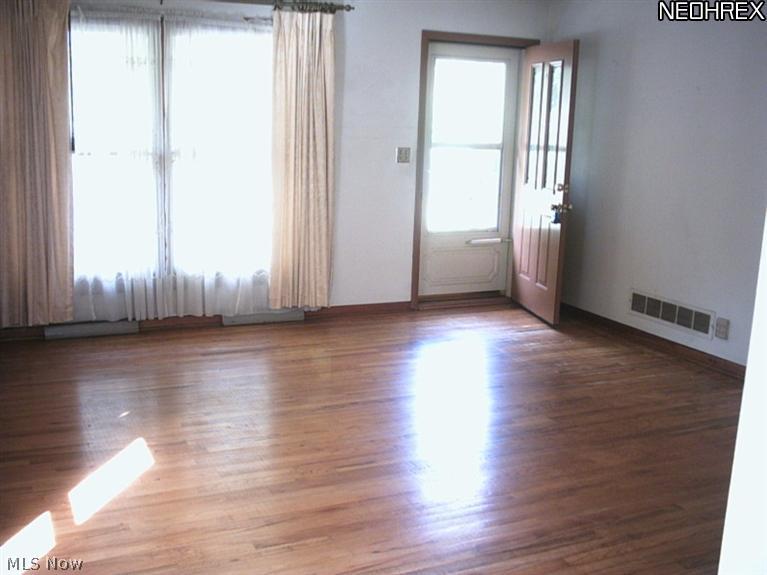 1464 Garman Road Akron, OH 44313 - Photo 2 of 23 Natural light makes the living room a pleasant place to gather!