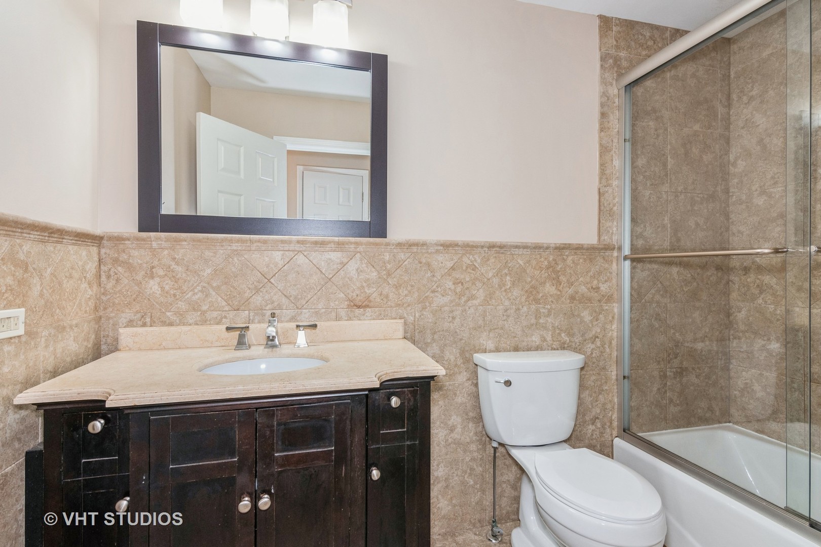501 Crossing Court Rolling Meadows, IL 60008 - Photo 11 of 14 a bathroom with a sink vanity mirror and toilet