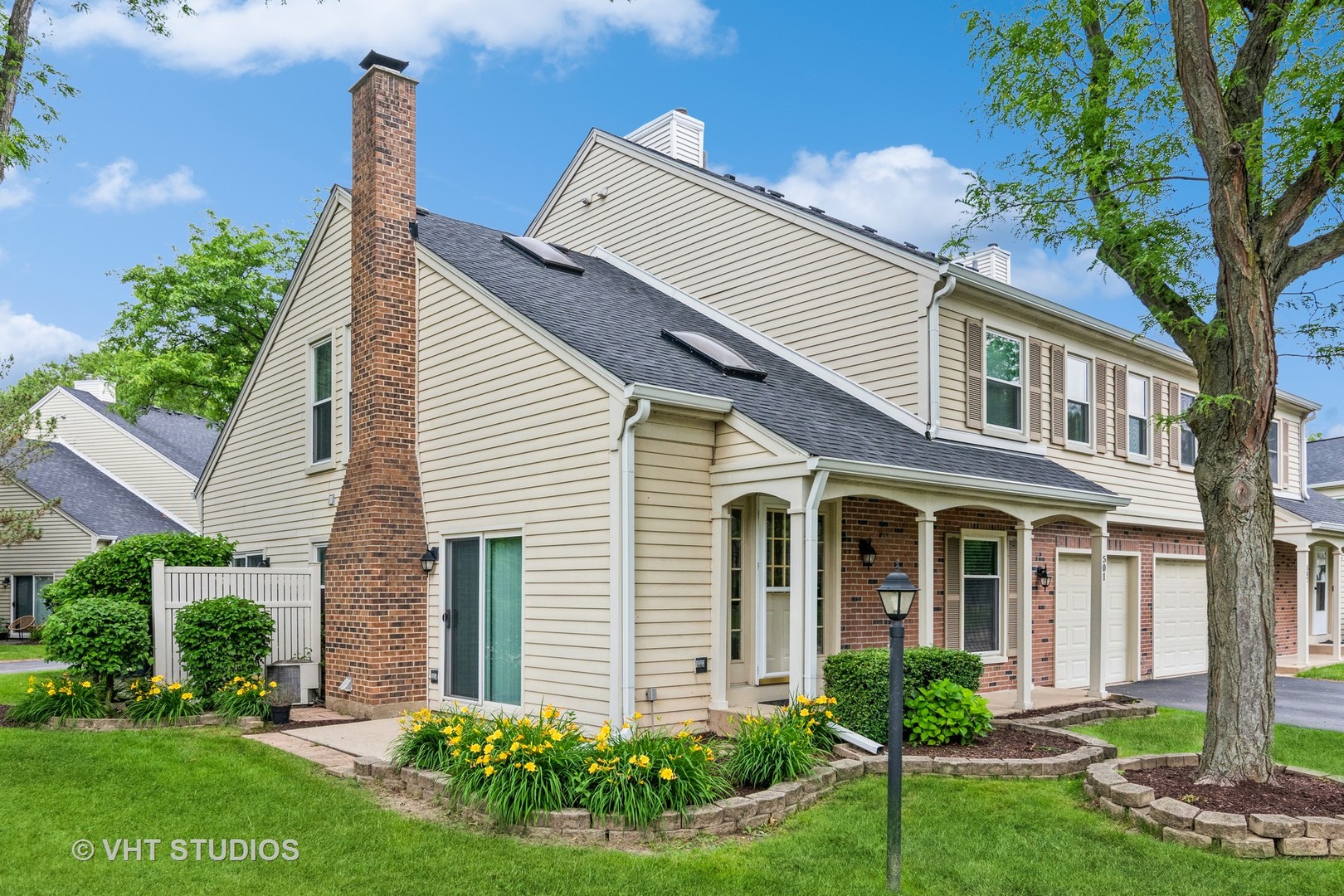 501 Crossing Court Rolling Meadows, IL 60008 - Photo 2 of 14 a front view of a house with garden and plants