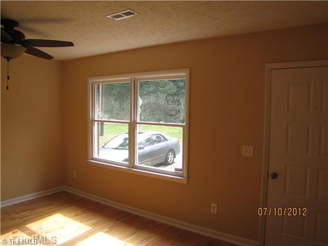 4770 Pine Hall Road Walkertown, NC 27051 - Photo 3 of 16 Living Room. Hardwood Floors in the LR.