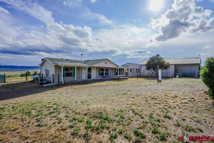 24900 Hilltop Road Trinidad, CO 81082 - Photo 1 of 17 a front view of a house with a yard