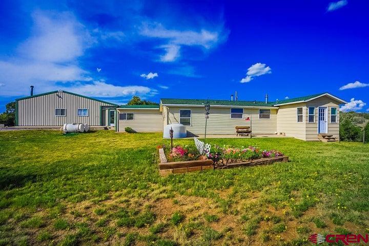 24900 Hilltop Road Trinidad, CO 81082 - Photo 3 of 17 a front view of a house with a yard