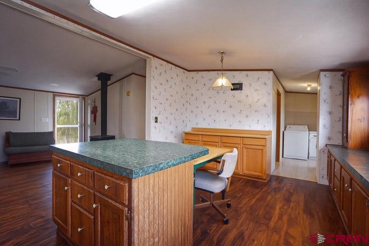 24900 Hilltop Road Trinidad, CO 81082 - Photo 6 of 17 a kitchen with a table and chairs in it