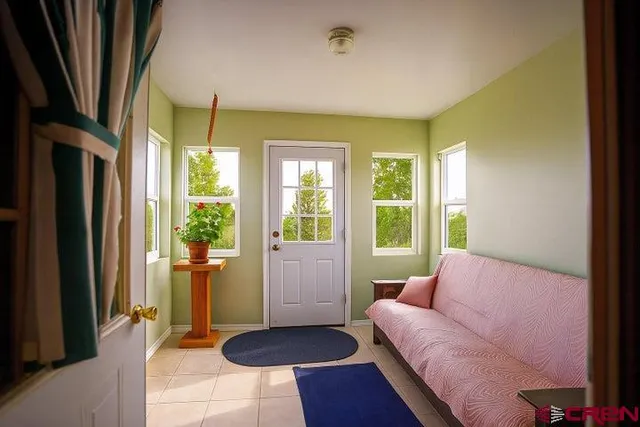 a living room with furniture and a rug