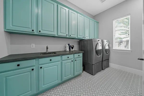 a kitchen with stainless steel appliances granite countertop a refrigerator and a cabinets