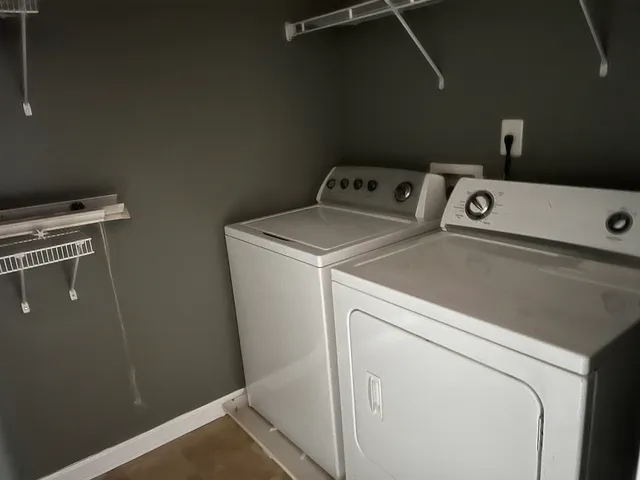 a white toilet sitting next to a bathroom sink and tub