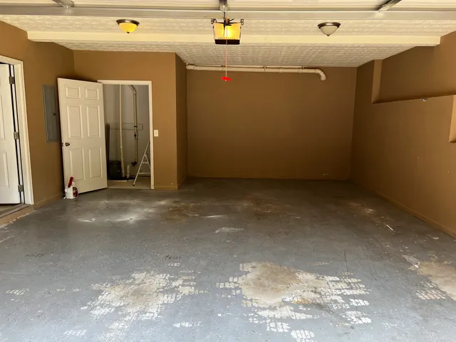 a view of a wooden house and a yard