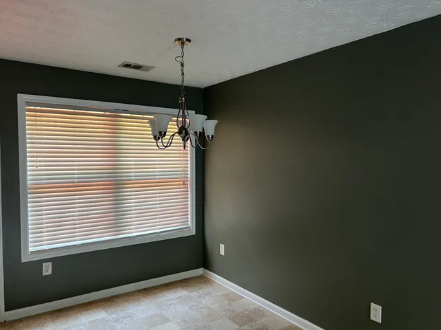 a kitchen with a refrigerator sink and stove