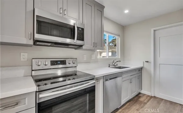 a kitchen with a stove and a microwave