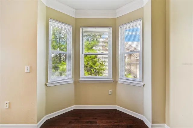 a kitchen with granite countertop a stove a sink and a microwave